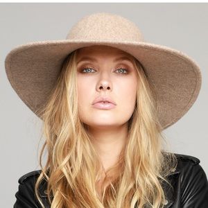 Soft wool hat with metal and suede band. 100% wool